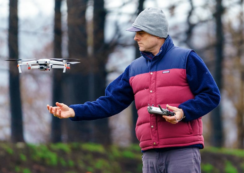 Ralph Bloemers has been documenting the areas affected by the 2020 Santiam Fire. He retrieves a drone after photographing a heavily burned area, Feb. 26, 2021, and will compare the images to those he shot previously to see how the area is recovering.