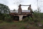 A home that was destroyed by a dam break stands in ruins in Bento Rodrigues, Minas Gerais state, Brazil, Oct. 19, 2024. Victims of Brazil’s worst environmental disaster, on Nov. 5, 2015, took their case for compensation to a UK court on Monday, Oct. 21, 2024, almost nine years after tons of toxic mining waste poured into a major waterway, killing 19 people and devastating local communities.