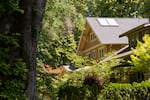 A house in Ladd's Addition neighborhood in Portland, Ore., on June 22, 2026. While some inner Portland neighborhoods have lush tree cover that reduces temperatures nearby, farther out a lack of trees can contribute to higher temperatures.
