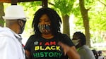 Co-founder of the Black Resilience Fund, Salomé Chimuku, speaking with an attendee of a July event where volunteers conducted in-person intakes and distributed funds to Black Portlanders in need.