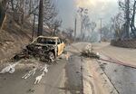 Wed., Jan. 8: A car is seen burned along the along the Pacific Coast Highway.