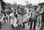 Local residents mourn as a truck carrying caskets of dead relatives arrives in Guadalupe, San Vicente department, El Salvador, May 9, 1983. (Photo by Robert Nickelsberg/Getty Images)