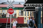 People walk towards the Astoria Riverfront Trolley, Astoria, Ore., Aug 10, 2024. 