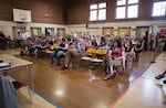Portland Public Schools Superintendent Carole Smith responds to a parent asking her to resign during a meeting at Rose City Park school in Portland, Oregon. “Does that fire alarm work? Is there asbestos in those vents? Do you want to tell us what works and doesn’t work in our school?” demanded Rob Neild, who has one child at Rose City Park.