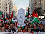 Demonstrators shout slogans and hold up an image of Handala, a symbol of Palestinian struggle, on Jan. 27 during a protest in Madrid in support of Palestinians and to demand a cease-fire in the Israel-Hamas war.