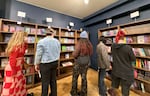 People browse the shelves at Grand Gesture Books on opening day, Oct. 26, 2024, in Portland, Ore. Grand Gesture is Oregon's first romance-only bookstore.