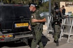 Israeli security forces secure a road near where Israel's government says a drone launched toward Israeli Prime Minister Benjamin Netanyahu's house in Caesarea, Israel, on Saturday.