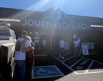 People meet at Journey Church in Bend, Ore., where parents and loved ones are waiting to be unified with students from Silver Rail Elementary School, Oct. 15, 2026, following reports of an active shooter.