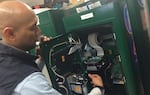 Meter technician Anto Bayu Aji shows us the interior of a Cale America meter.