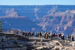 FILE - Tourists flock to Mather Point at Grand Canyon National Park, Oct. 1, 2025, in Grand Canyon, Ariz.
