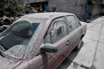 A car is covered with ashes Tuesday from the Popocatépetl volcano in the village of Santiago Xalitzintla in Puebla state, Mexico.