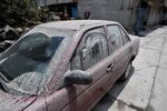 A car is covered with ashes Tuesday from the Popocatépetl volcano in the village of Santiago Xalitzintla in Puebla state, Mexico.