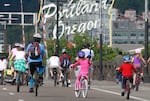 FILE - Bicyclists cross the Fremont Bridge during the Providence Bridge Pedal Sunday, Aug. 14, 2011, in downtown Portland, Ore.