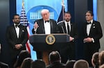 President Donald speaks, flanked by FBI Director Kash Patel, Secretary of Homeland Security Markwayne Mullin, and Acting Attorney General Todd Blanche, during a press briefing shortly after a shooting incident at the White House Correspondents' Dinner on April 25, 2026.