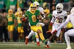 Oregon quarterback Dillon Gabriel (8) runs the ball during an NCAA college football game against Maryland, Saturday, Nov. 9, 2024, in Eugene, Ore.