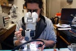 Research scientist Jason Hodin looks through a microscope at the University of Washington's Friday Harbor Labs on San Juan Island, Wash., in February.