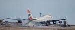 FILE: In this photograph taken Feb. 8, 2016, a British Airways plane touches down on a runway at Denver International Airport.