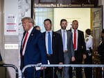 Former President Donald Trump leaves the courtroom during a break in his civil fraud trial on Oct. 17 in New York.