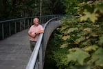 Reed College Facilities Operations Manager Zac Perry poses for a portrait next to a heat-stressed bigleaf maple on the Reed College campus.