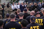 President Donald Trump speaks with members of law enforcement and National Guard soldiers on Aug. 21, 2025, in Washington.