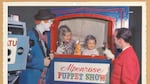 Rusty Nails watches over puppet show fun.