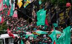 Mourners carry the coffins of Saleh Arouri, a senior Hamas commander, and two other Hamas members, who were killed in an airstrike on Tuesday in Beirut, Lebanon. Hamas blames Israel for the attack.