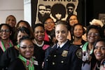 Portland Police Chief Danielle Outlaw poses with sorority sisters from Alpha Kappa Alpha, who filled several rows at her swearing in at the Oregon Historical Society.