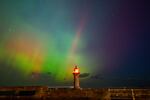 The northern lights, also know, as the aurora borealis, shines across Whitby Harbour, Whitby, UK, on Oct. 10. 