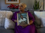 Melinda Mattocks-Ushry holds a photo of her brother Kelvin “Chuck” Mattocks at her home in New Bern, N.C., on Dec. 5, 2023. 