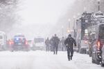 UNITED STATES - JANUARY 6: Police officers and vehicles line First Street NE in the snow outside the U.S. Capitol as security tightens in advance of the Joint Session of Congress to count the electoral votes on Monday, January 6, 2025. (Bill Clark/CQ-Roll Call, Inc via Getty Images)
