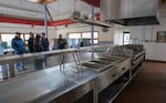 Members of the Chinook Indian Nation council take a look at the kitchen area of the Naselle Youth Camp in Naselle, Washington.