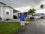 Stanley Paxton at the site where he fell at Heritage Plantation. He and other residents say floodwaters often leave behind a slimy residue that's easy to slip and fall on. Wednesday, June 8, 2022, in Vero Beach.