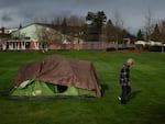 A homeless person walks near an elementary school in Grants Pass, Ore., on March 23.  The rural city became the unlikely face of the nation's homelessness crisis when it asked the U.S. Supreme Court to uphold its anti-camping laws. 