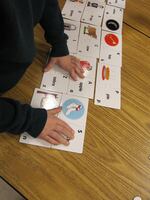 Kindergarten students match letters and sounds with images (file photo).