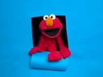 FILE - Elmo of the film "Being Elmo" poses for a portrait in the Fender Music Lodge during the 2011 Sundance Film Festival in Park City, Utahm Jan. 24, 2011. (AP Photo/Victoria Will, File)