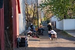 Since camping and shelter restrictions were passed, Clarkston’s homeless encampment has dwindled from 75 people to about 20. Those who remain are forced to move their belongings, creating piles of supplies in an alleyway near Foster Park.