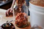 The mixed kimchi is packed tightly into a jar before fermenting at room temperature for five to 10 days.