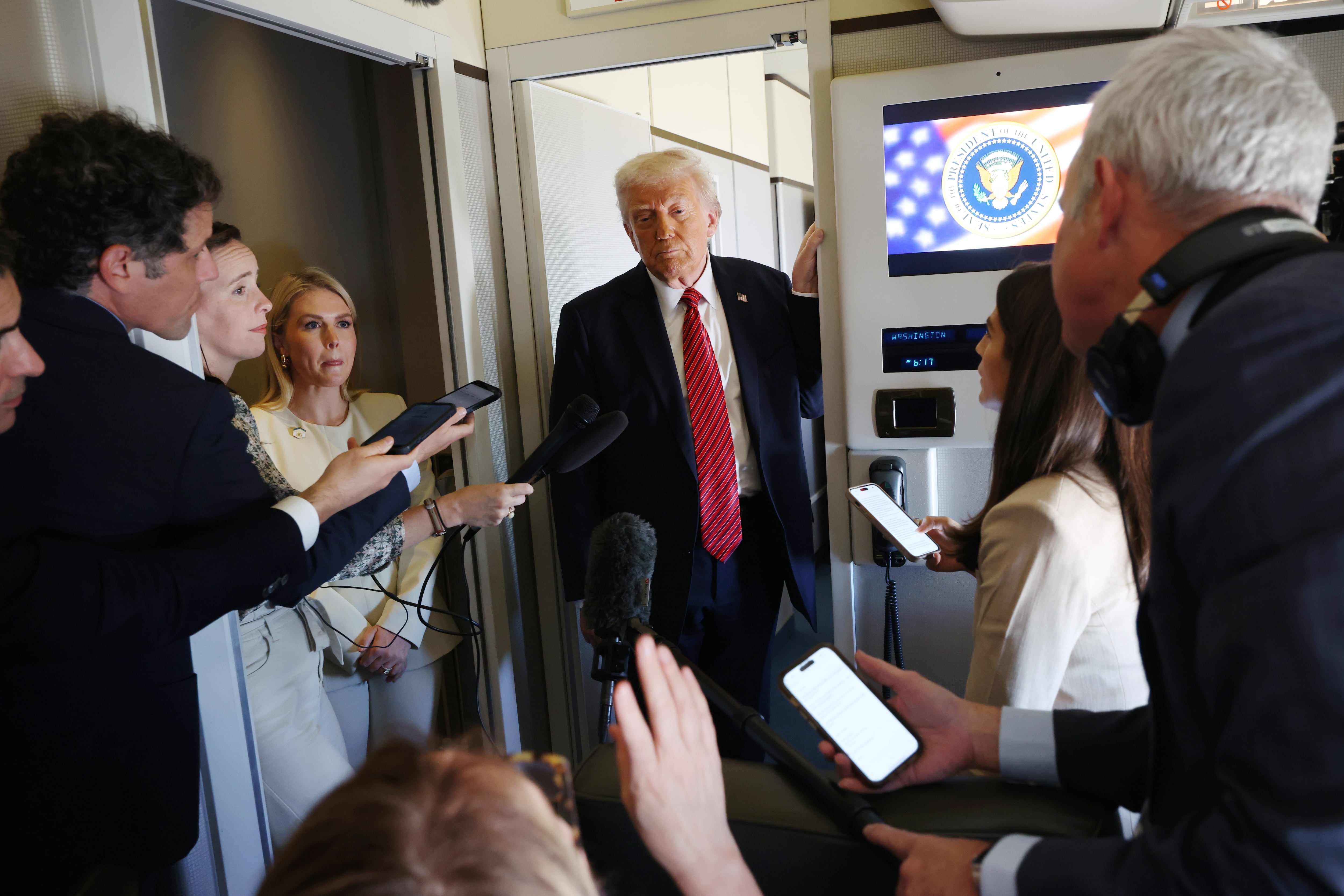 President Trump speaks to reporters on Air Force One about his meeting with Syria's interim president while flying to Doha, Qatar on May 14, 2025.
