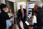 President Trump speaks to reporters on Air Force One about his meeting with Syria's interim president while flying to Doha, Qatar on May 14, 2025.