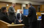 Defense attorney Greg Scholl (left) and prosecutors Don Rees and Jeff Howes discuss legal matters before a recess at the Multnomah County Courthouse on Feb. 13, 2020, day 11 in the trial of Jeremy Christian for the stabbing of three people on a MAX train in Portland in May 2017.