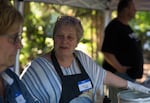 Kate Zeller Lamb, a lifelong Maywood Park resident, serves hotdogs at the annual National Night Out event at the Maywood Commons on Saturday, July 27, 2019, in Maywood Park, Ore.