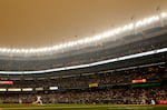 General view of hazy conditions resulting from Canadian wildfires as Clarke Schmidt #36 of the New York Yankees pitches during the first inning against the Chicago White Sox at Yankee Stadium on June 06, 2023 in the Bronx borough of New York City.