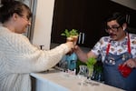 Joshua Madrid and his producer, which is his wife, Chelsae Madrid, cheers during his virtual happy hour Saturday, May 9, 2020, in Portland, Ore. Madrid started broadcasting drink-mixing lessons on his Facebook page when the COVID-19 pandemic forced closure of Oregon bars and restaurants.