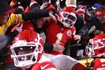 Xavier Worthy #1 of the Kansas City Chiefs jumps into the stands after scoring a touchdown during the second quarter against the Buffalo Bills in the AFC Championship Game at GEHA Field at Arrowhead Stadium on Jan. 26 in Kansas City, Missouri.