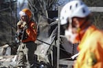 Search and rescue workers dig through the rubble left behind by the Eaton Fire, in Altadena, Calif., Tuesday, Jan. 14, 2025.