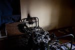 A burned cot in a police station in Kherson on Wednesday. Kherson residents say Russians used the police station to detain and torture violators of curfew and people suspected of collaborating with Ukrainian authorities.