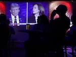 People watch the presidential debate between Vice President Harris and former President Donald Trump during a debate watch party at Penn Social on Sept. 10 in Washington, D.C.