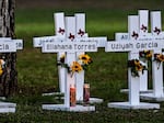 Crosses adorn a makeshift memorial for the shooting victims at Robb Elementary School. NPR has not independent verified the names.