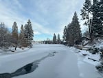 A thin layer of ice covers the Deschutes River in Bend, Ore., on Sunday, Jan. 14, 2024.