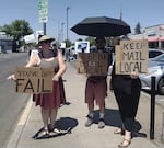 A rally in July in front of the Medford post office against the proposed changes.